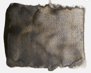 A swatch of Random Grey 2026 by Schmincke. It is a dark brown-grey paint.